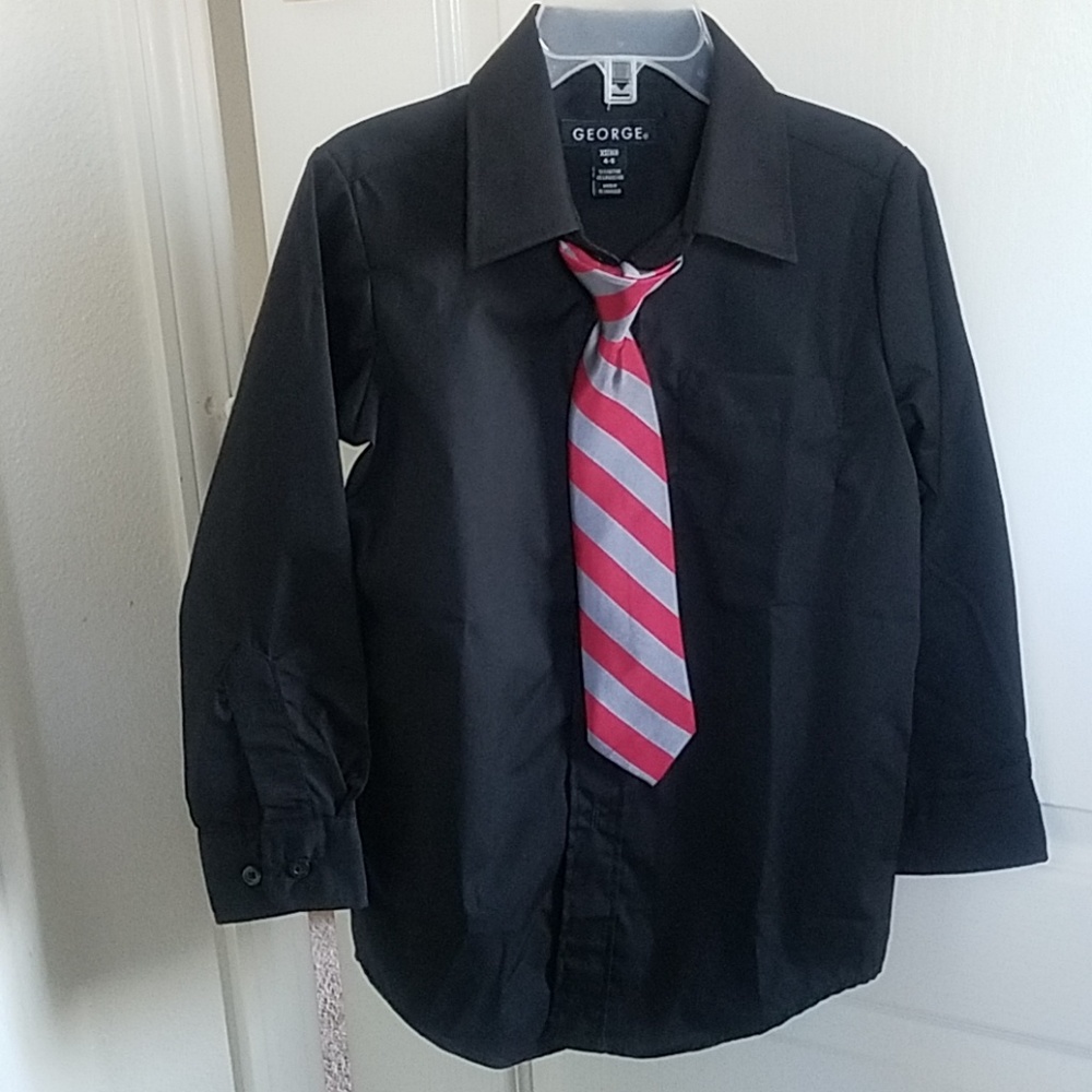 Boys black dress shirt worn tie